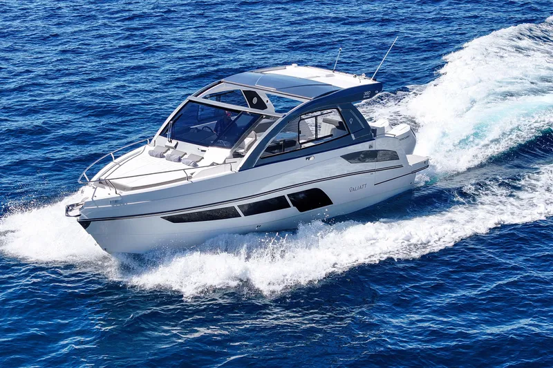 Slide: The Image of 2025 VALIATT YACHTS 380 Bowrider cruising on open blue sea. - 2