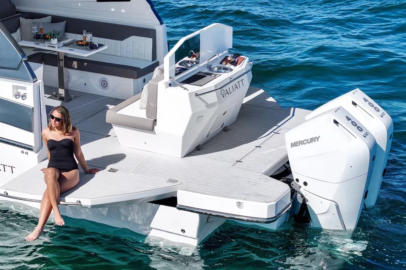Slide: The Image of 2025 VALIATT YACHTS 380 Bowrider on water, featuring luxury seating and Mercury engines. - 18