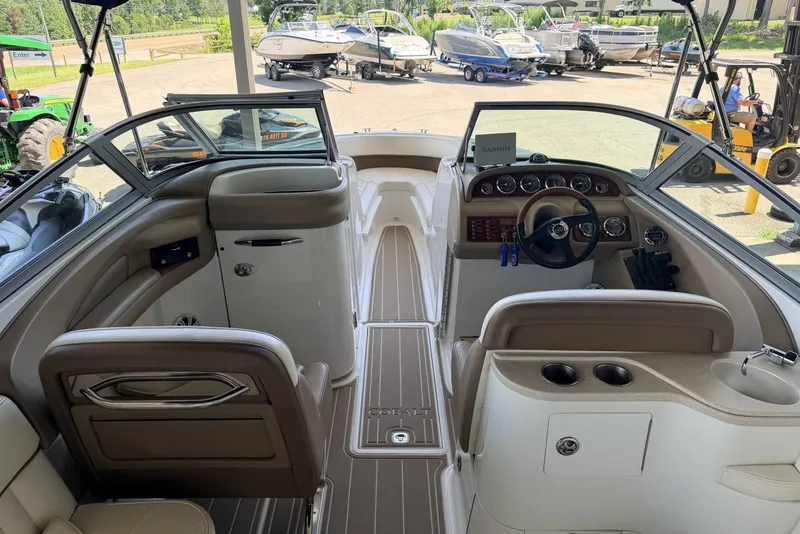 Slide: The Image of Interior view of a 2008 Cobalt 282 boat with steering wheel and seating. - 25