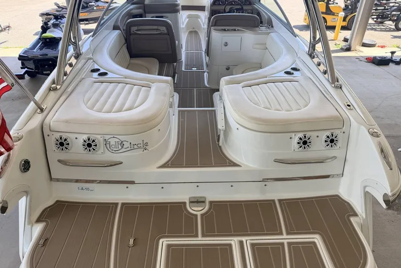 Slide: The Image of Interior of a 2008 Cobalt 282 boat with white seating and brown flooring. - 12