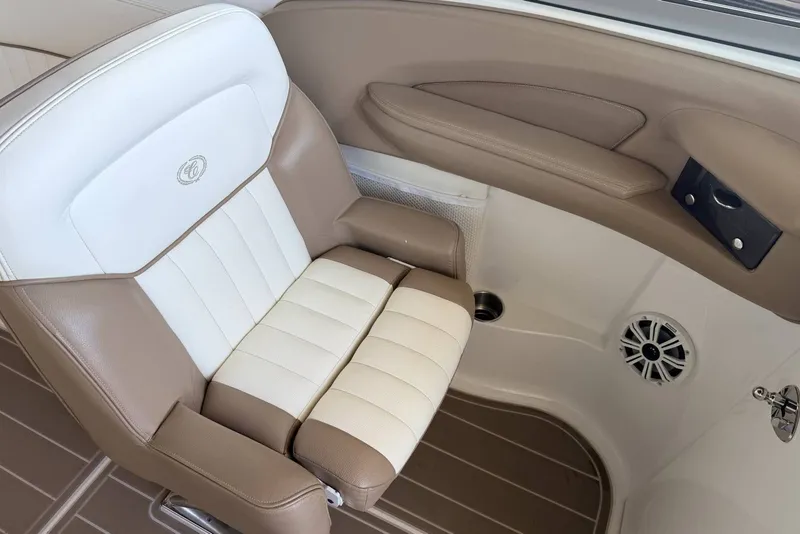 Slide: The Image of Luxurious seating in a 2008 Cobalt 282 boat, featuring beige and white upholstery. - 16