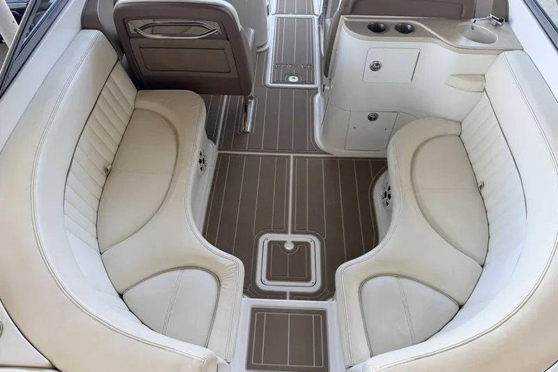 Slide: The Image of Luxurious interior of a 2008 Cobalt 282 boat with beige seating and wood flooring. - 15
