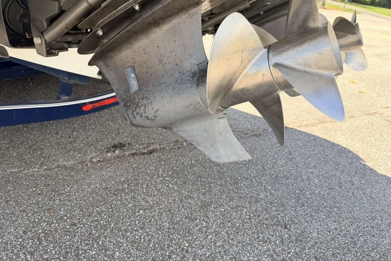 Slide: The Image of Close-up of a 2008 Cobalt 282 boat propeller on pavement. - 8