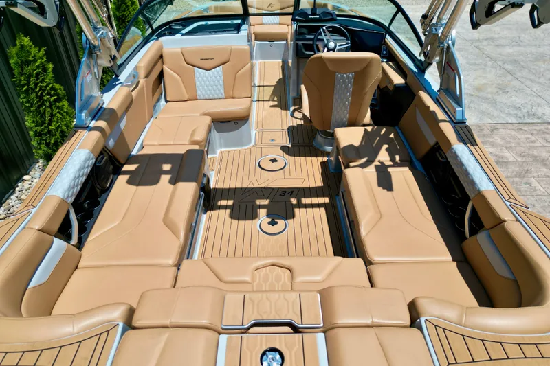 Slide: The Image of Luxurious interior of 2026 MasterCraft XT24 boat with tan seating and modern design. - 10