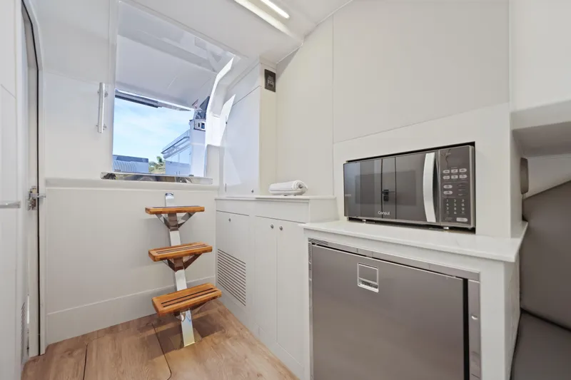Slide: The Image of Modern interior of 2025 VALIATT YACHTS 380 Bowrider with microwave and compact fridge. - 20