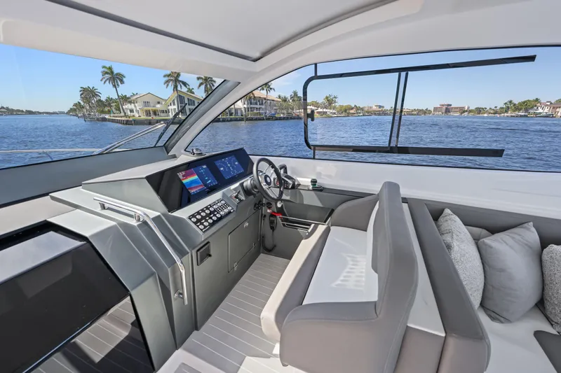 Slide: The Image of 2025 VALIATT YACHTS 380 Bowrider interior with modern helm and waterfront view. - 14