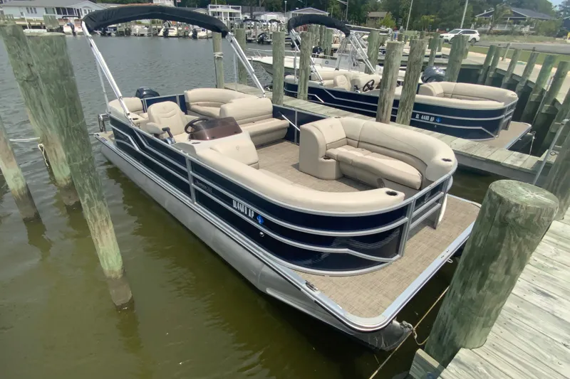 The Image of 2023 Cypress Cay Seabreeze 232 pontoon boat docked at marina. - 1