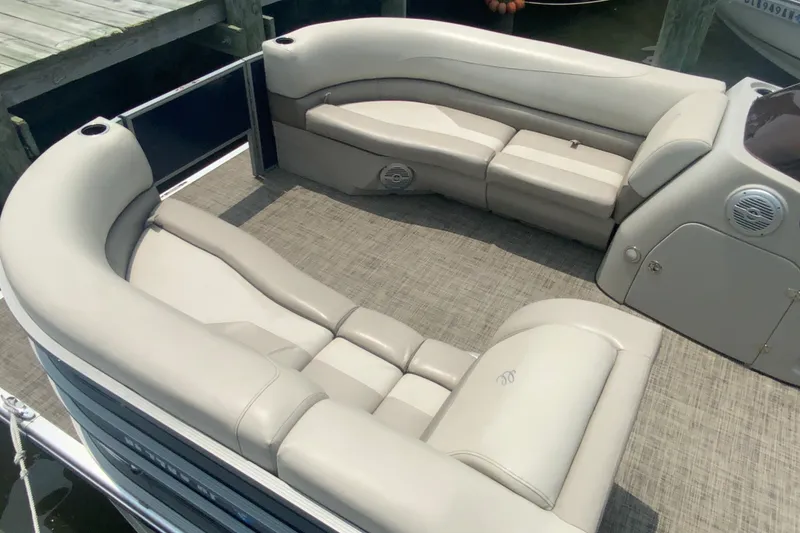 Slide: The Image of Luxurious seating on 2023 Cypress Cay Seabreeze 232 pontoon boat, featuring elegant beige upholstery. - 7