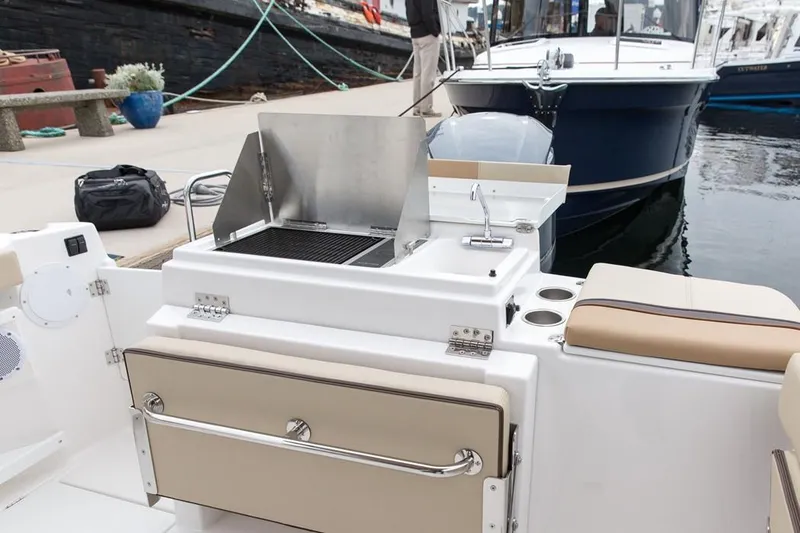 Slide: The Image of Manufacturer Provided Image: 2019 Ranger Tugs R-27 boat with outdoor kitchen and grill at the dock. - 14