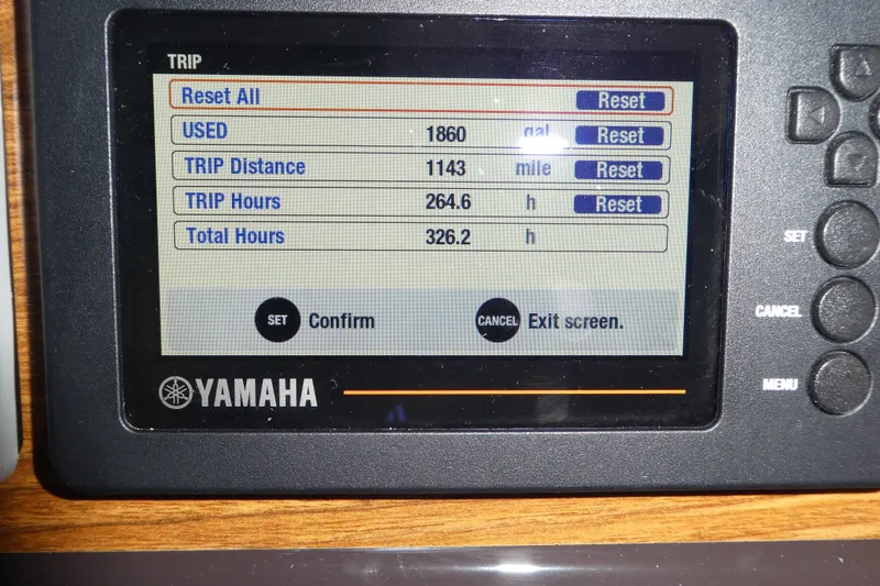 Slide: The Image of Yamaha display showing trip data: 1860 gallons used, 1143 miles traveled, 264.6 trip hours. - 58