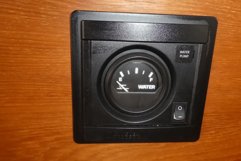 Slide: The Image of Water level gauge and pump switch on 2019 Ranger Tugs R-27 boat. - 35