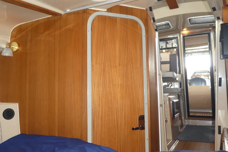 Slide: The Image of Interior of 2019 Ranger Tugs R-27 boat, featuring wooden paneling and modern design elements. - 44