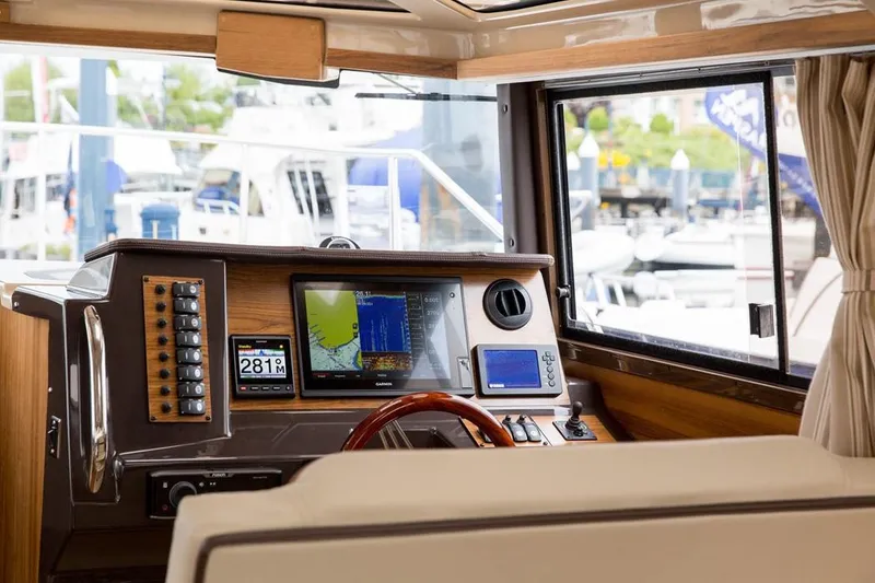 Slide: The Image of Manufacturer Provided Image: 2019 Ranger Tugs R-27 helm with navigation equipment and controls. - 16