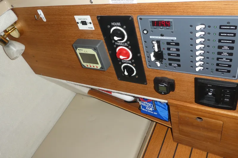 Slide: The Image of Control panel of a 2019 Ranger Tugs R-27 boat with switches and meters. - 46