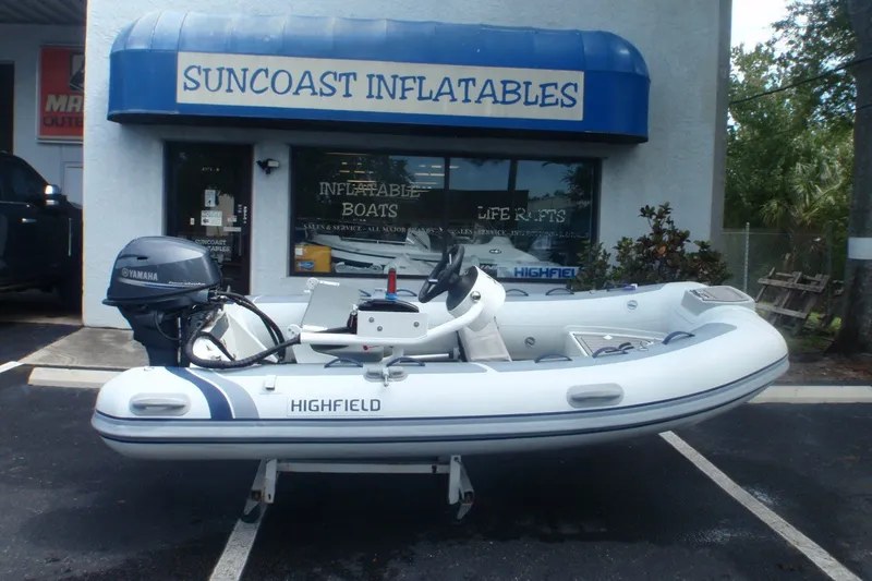 The Image of 2023 Highfield Classic 340 FCT inflatable boat displayed outside Suncoast Inflatables store. - 0
