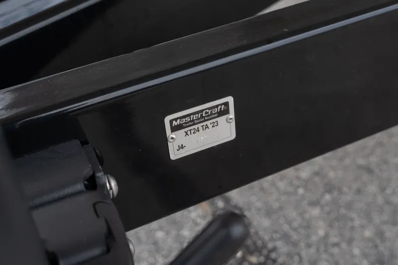 Slide: The Image of Close-up of 2023 MasterCraft XT24 trailer serial number plate on black frame. - 46