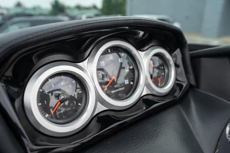 Slide: The Image of Dashboard gauges of 2023 MasterCraft XT24 boat, featuring speedometer and tachometer. - 17