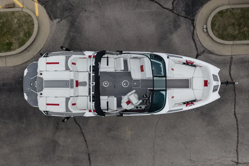 Slide: The Image of Overhead view of a 2023 MasterCraft XT24 boat on pavement. - 43