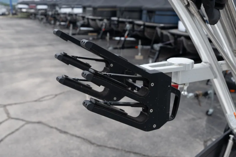 Slide: The Image of 2023 MasterCraft XT24 boat rack detail in a marina setting. - 35