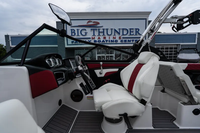 Slide: The Image of 2023 MasterCraft XT24 boat interior at Big Thunder Marine dealership. - 24