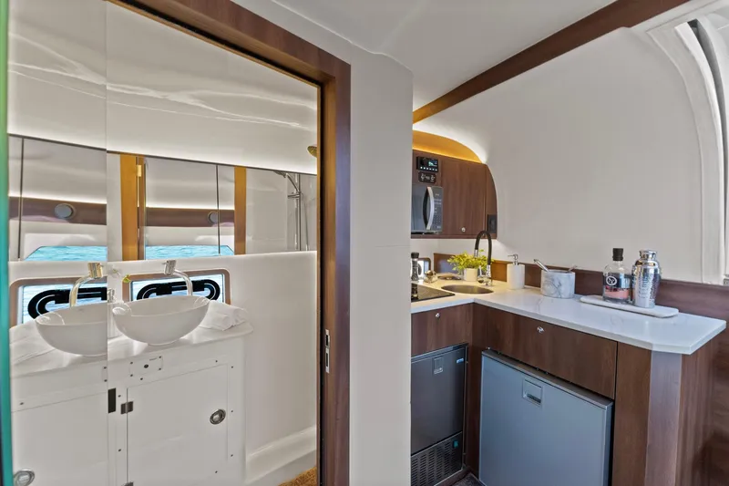 Slide: The Image of Luxurious interior of 2025 Valiatt 380GT yacht featuring modern kitchenette and bathroom. - 18