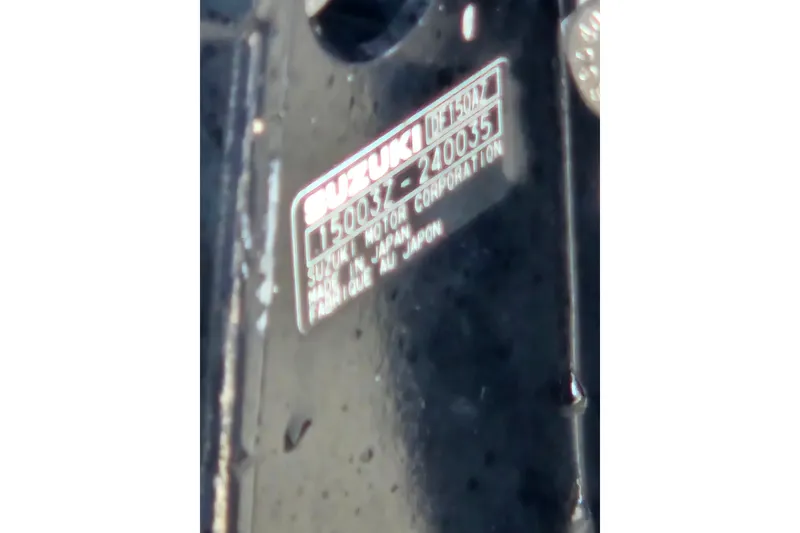 Slide: The Image of Close-up of Suzuki motor label on 1997 Wellcraft 30 Scarab Sport. - 21