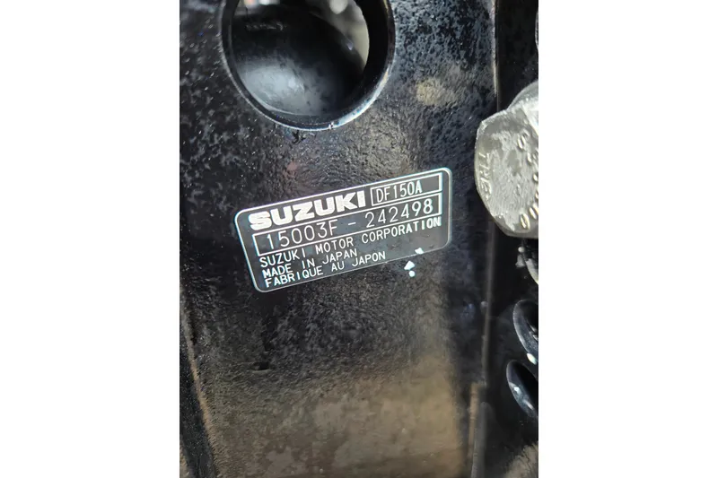 Slide: The Image of Close-up of a Suzuki motor label on a 1997 Wellcraft 30 Scarab Sport boat. - 20