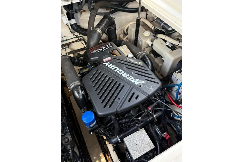 Slide: The Image of Engine compartment of a 2005 Sea Ray 340 Sundancer with MerCruiser components. - 23