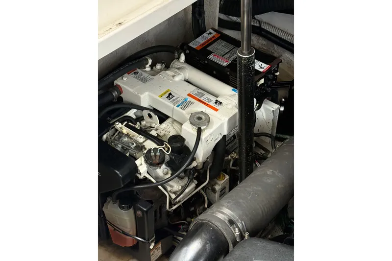 Slide: The Image of Engine compartment of a 2005 Sea Ray 340 Sundancer boat, showcasing mechanical components. - 22