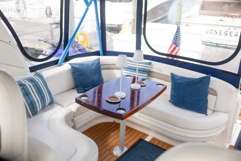 Slide: The Image of Luxurious interior of 2005 Sea Ray 340 Sundancer with plush seating and elegant table. - 7