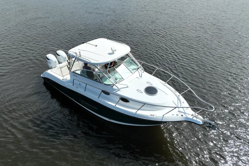 Slide: The Image of 2004 Seaswirl Striper 2901 Walkaround O/B boat on calm water, aerial view. - 17