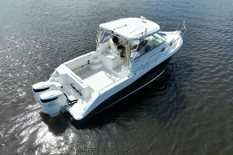 Slide: The Image of 2004 Seaswirl Striper 2901 Walkaround O/B boat on calm water, aerial view. - 16