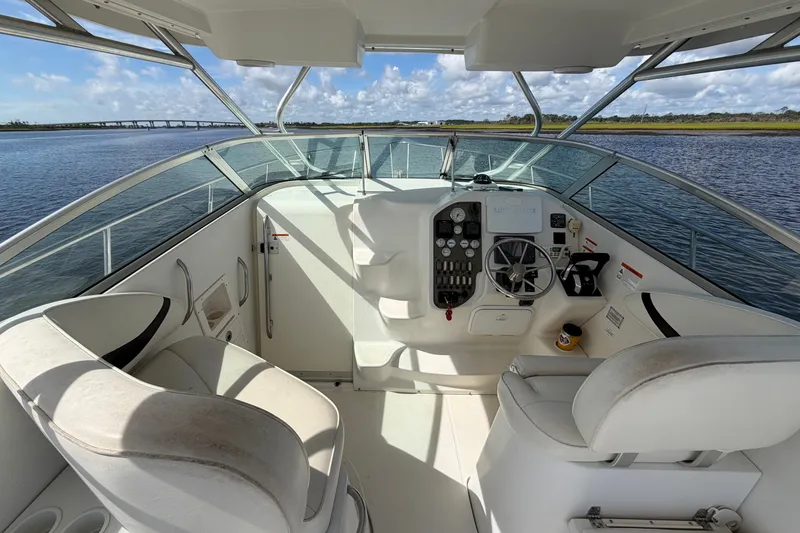 Slide: The Image of 2004 Seaswirl Striper 2901 Walkaround O/B helm with scenic water view. - 23