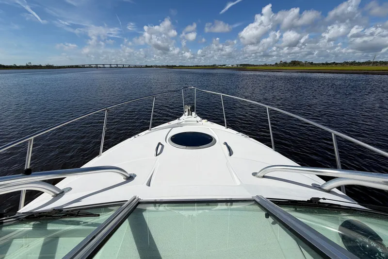 Slide: The Image of 2004 Seaswirl Striper 2901 Walkaround O/B cruising on calm waters under a blue sky. - 28