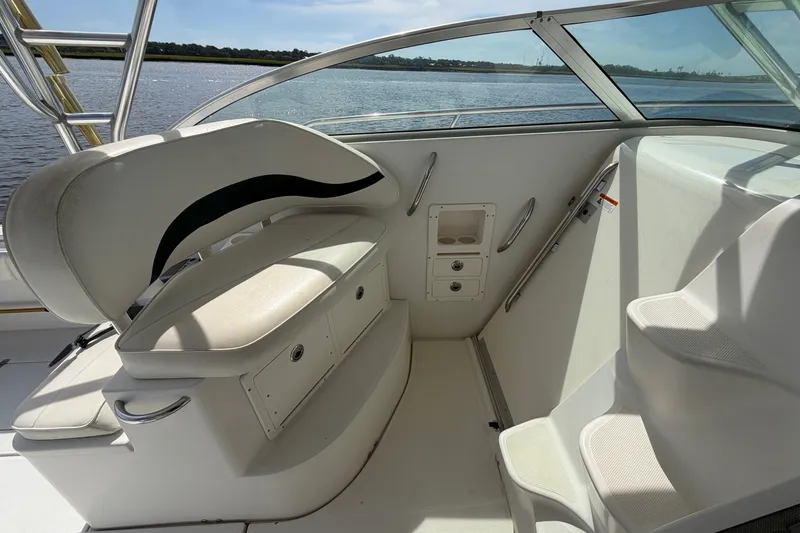 Slide: The Image of 2004 Seaswirl Striper 2901 Walkaround O/B boat interior with seating and storage. - 24