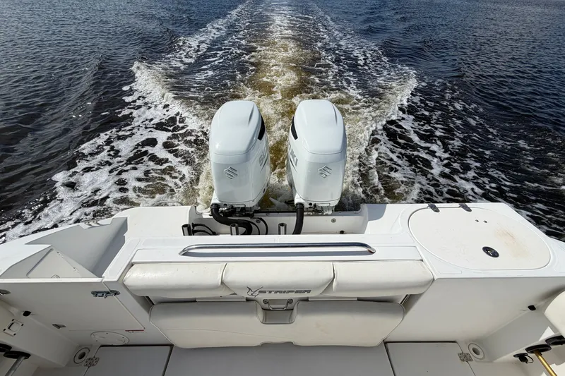 Slide: The Image of 2004 Seaswirl Striper 2901 Walkaround O/B with dual outboard motors on open water. - 20
