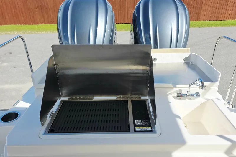 Slide: The Image of Outdoor kitchen on 2027 Cutwater C-32 Coupe boat with grill and sink. - 4