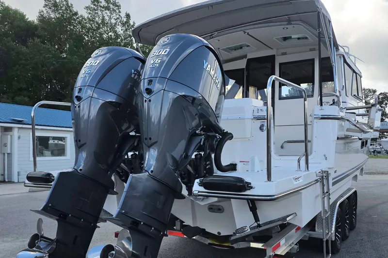 Slide: The Image of 2027 Cutwater C-32 Coupe with dual Yamaha 300 V6 outboard engines. - 2