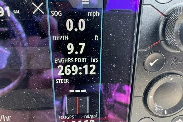 Slide: The Image of Display panel of 2023 Boston Whaler 325 Conquest showing depth and engine hours. - 38