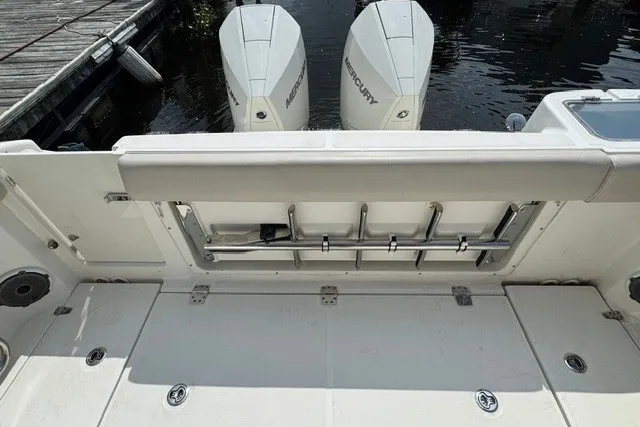 Slide: The Image of 2023 Boston Whaler 325 Conquest boat deck with dual Mercury engines. - 24