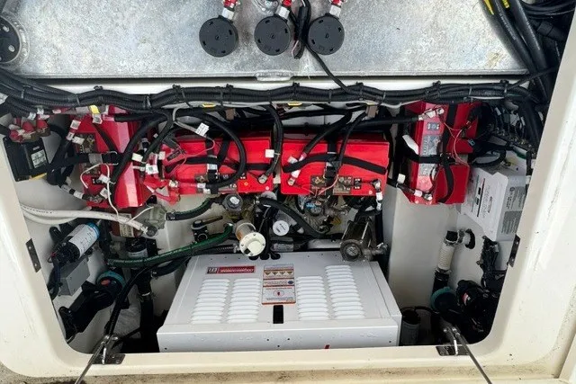 Slide: The Image of Engine compartment of 2023 Boston Whaler 325 Conquest, showcasing wiring and components. - 50