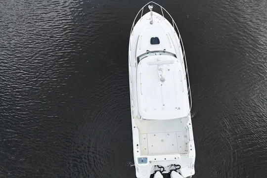 Slide: The Image of Aerial view of 2023 Boston Whaler 325 Conquest boat on calm water. - 17