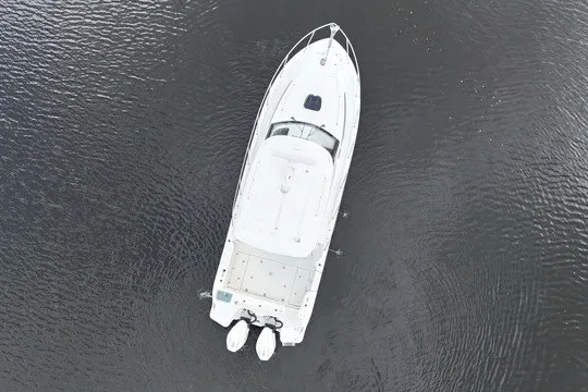 Slide: The Image of Aerial view of 2023 Boston Whaler 325 Conquest boat on calm water. - 18