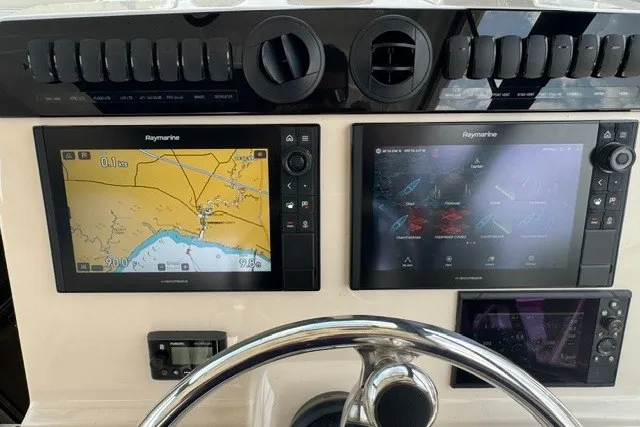 Slide: The Image of Control panel of 2023 Boston Whaler 325 Conquest with Raymarine navigation displays. - 37