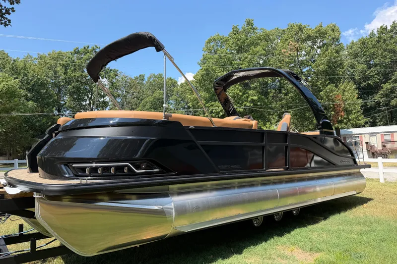 Slide: The Image of 2027 Harris Grand Mariner 250 SLDH pontoon boat on trailer, outdoors. - 11