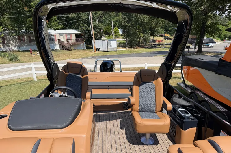 Slide: The Image of 2027 Harris Grand Mariner 250 SLDH pontoon boat interior with luxurious seating and helm. - 20
