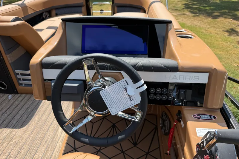 Slide: The Image of Steering console of 2027 Harris Grand Mariner 250 SLDH with modern controls and display. - 18