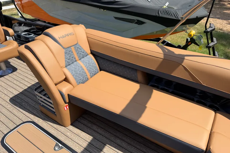 Slide: The Image of Luxurious seating on 2027 Harris Grand Mariner 250 SLDH pontoon boat, featuring tan and gray upholstery. - 21