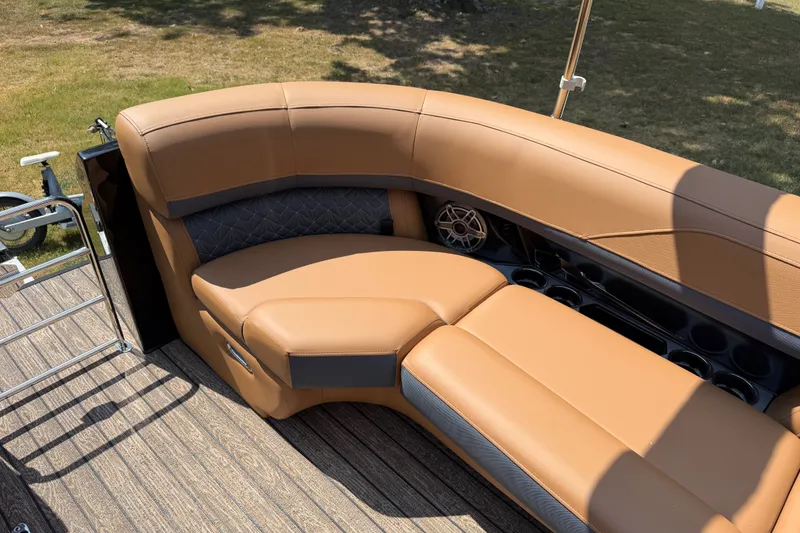 Slide: The Image of Luxurious seating on 2027 Harris Grand Mariner 250 SLDH pontoon boat, featuring tan upholstery. - 23