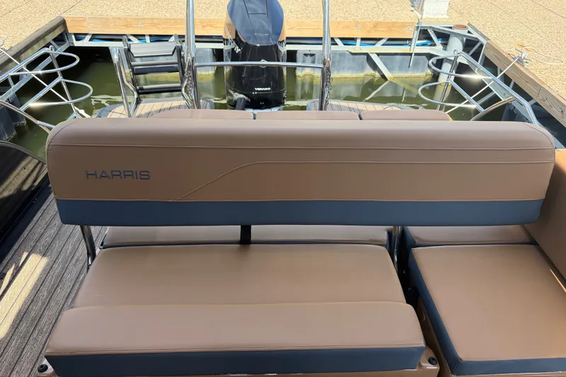 Slide: The Image of Luxury seating on 2027 Harris Grand Mariner 250 SLDH pontoon boat, docked by water. - 5